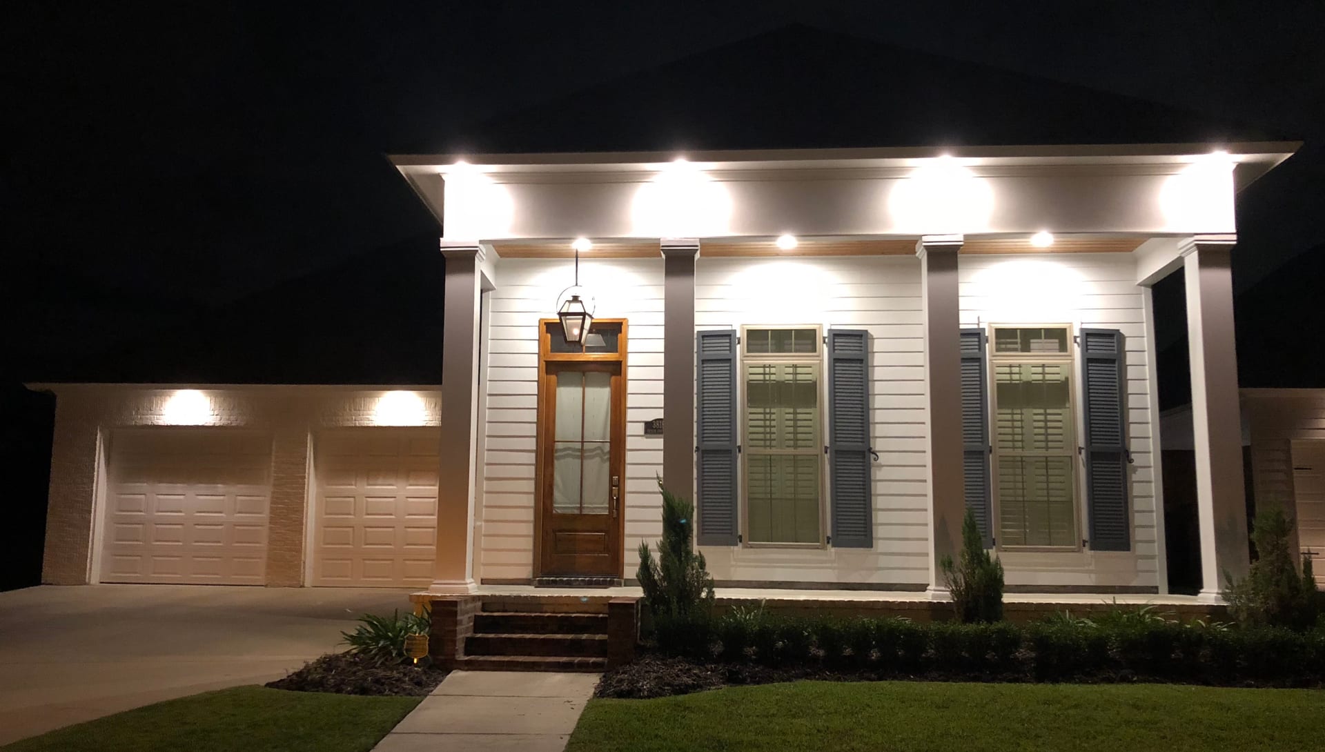 Home with beautiful eave lighting at night